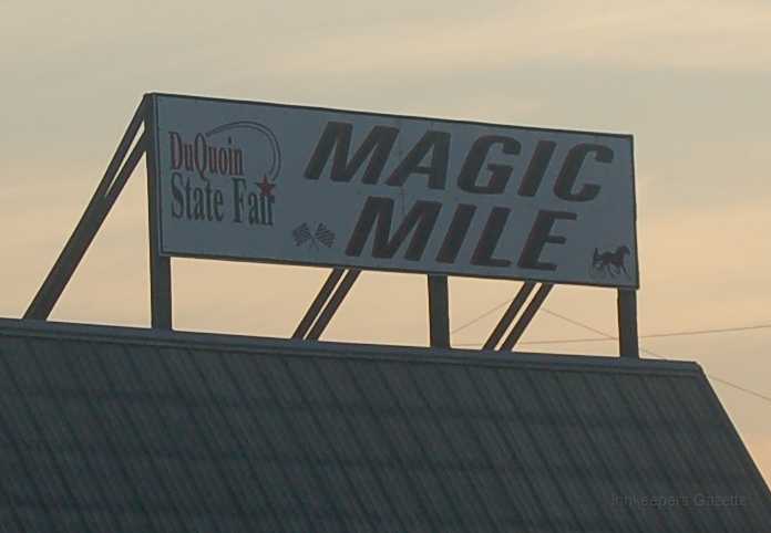 DuQuoin 2006 004 crop.JPG - The day started early at the track.  Donnie Warf, dirt track coordinator for AHRMA, rode to DuQuoin with me.  He had had to be at the track at 5:00am to prepare for registration -- which began at 6:00am.  That meant his chauffeur (me) had to be there too.